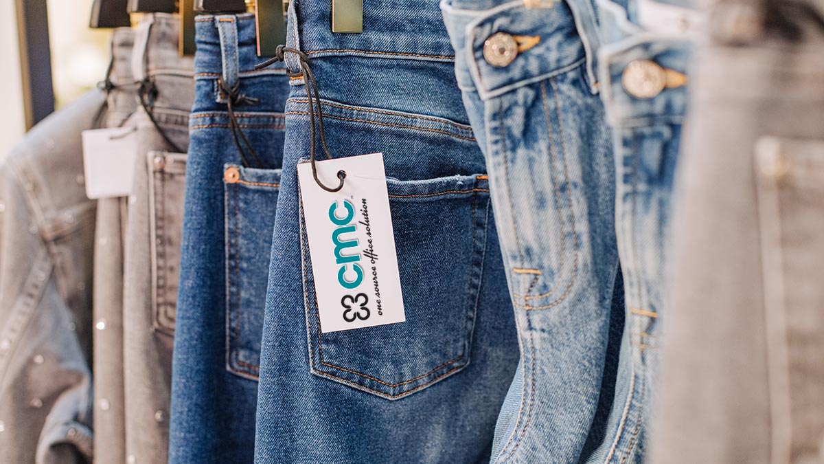 sale assortment denim collection on the stand in a stylish boutique shop selection